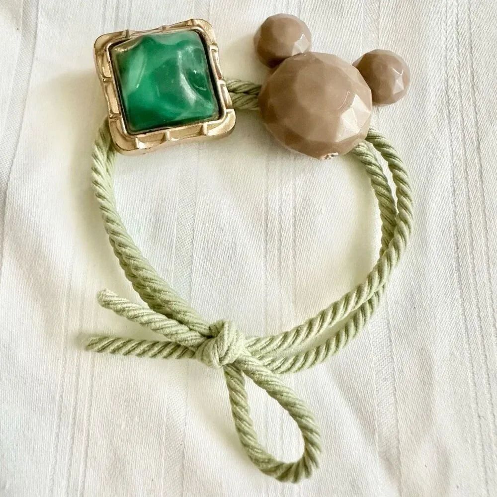 Green and light brown color Mickey Mouse hair tie